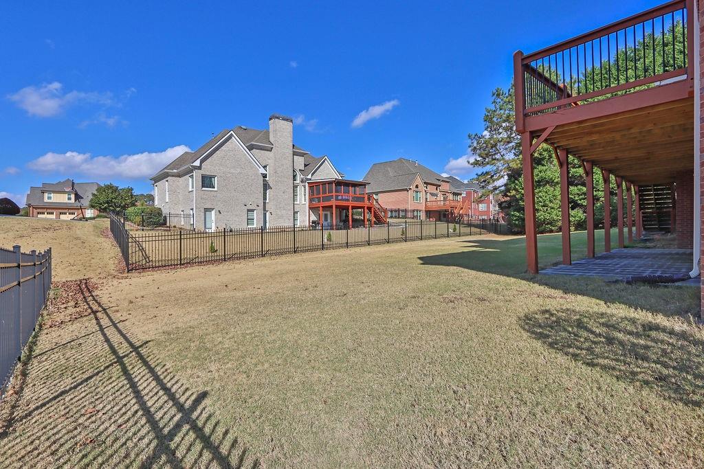737 Heritage Post Lane Southwest Grayson, GA 30017 - Photo 49 of 50 a view of a house with a yard