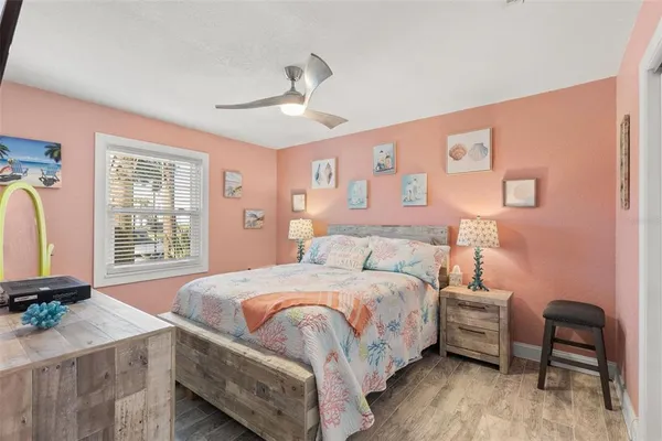 a bedroom with a bed and a chair