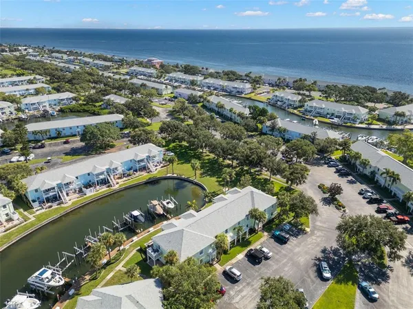 an aerial view of a house with a ocean view