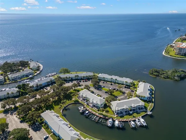 an aerial view of a house with a lake view