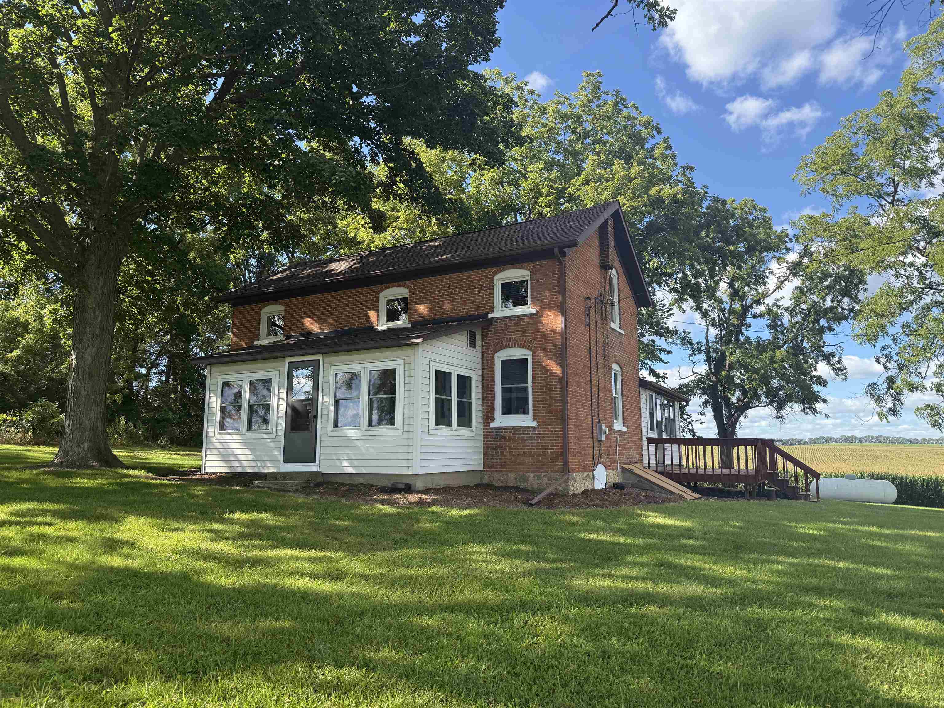 a front view of house with yard and green space