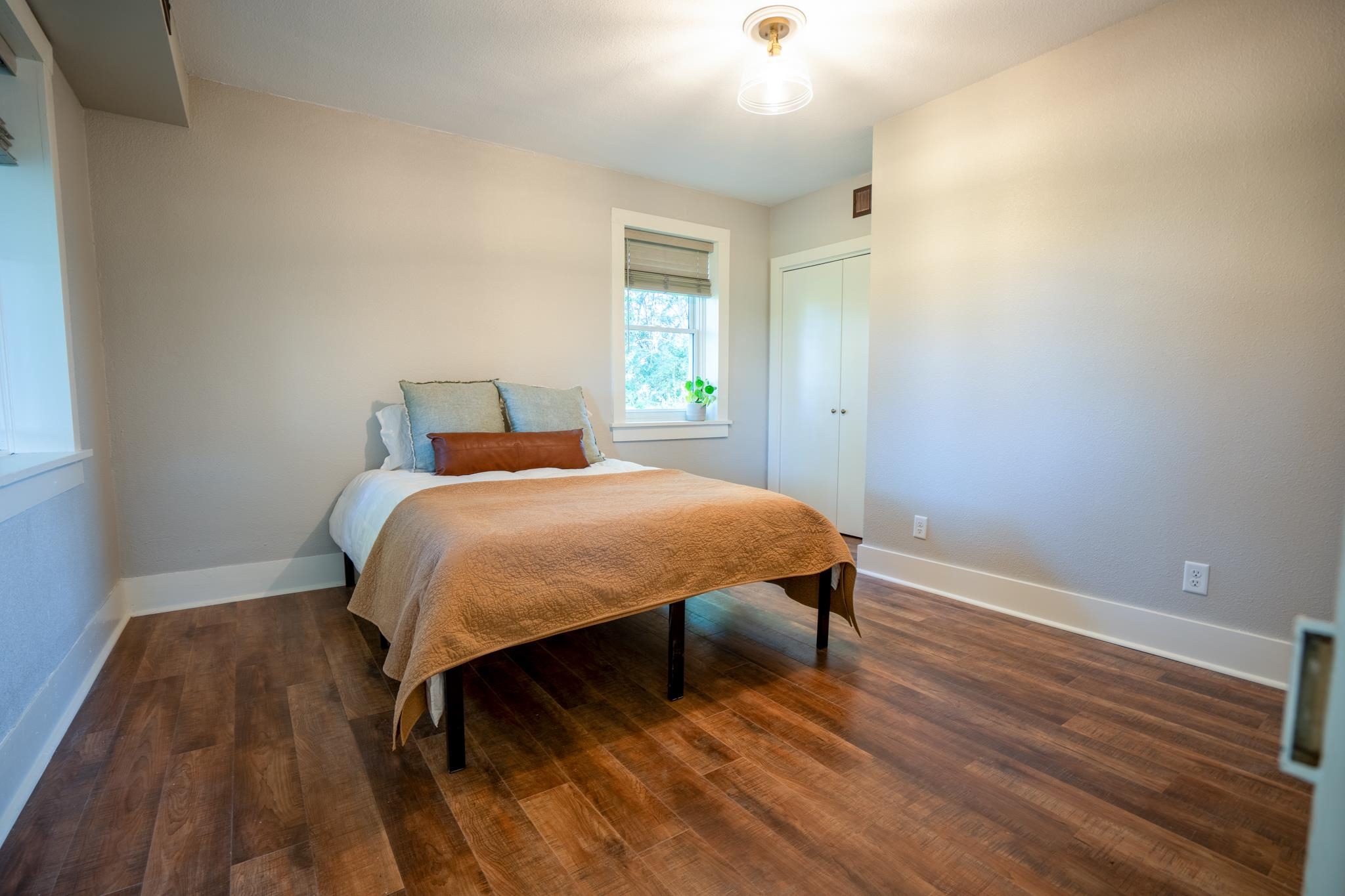 2368 West Winneshiek Road Freeport, IL 61032 - Photo 17 of 39 a bedroom with a bed and wooden floor