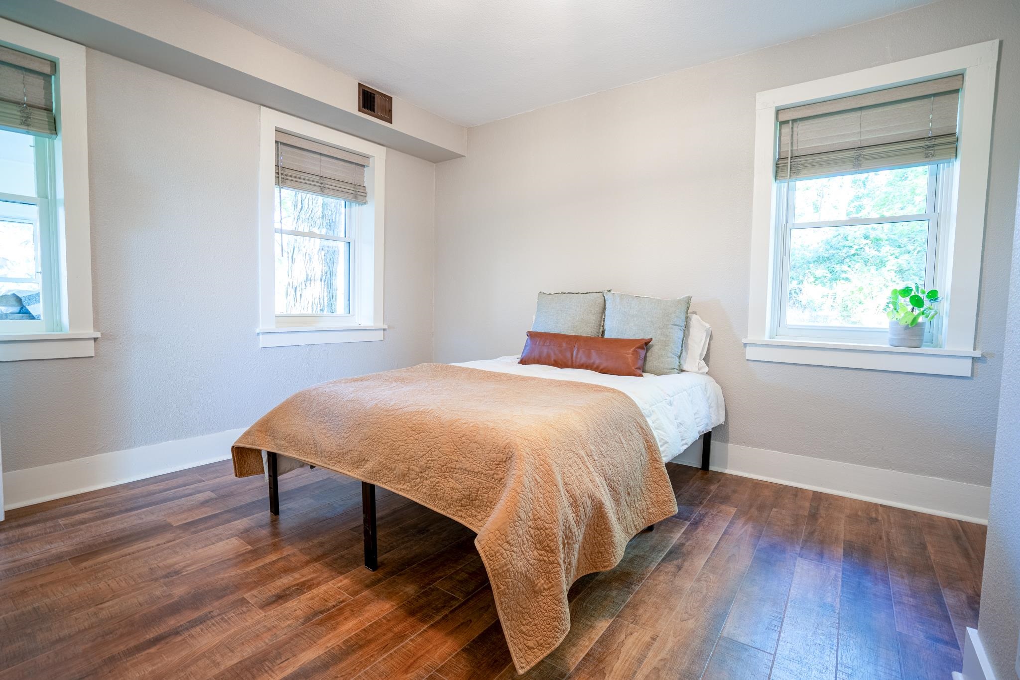 2368 West Winneshiek Road Freeport, IL 61032 - Photo 18 of 39 a bedroom with a bed a window and wooden floor