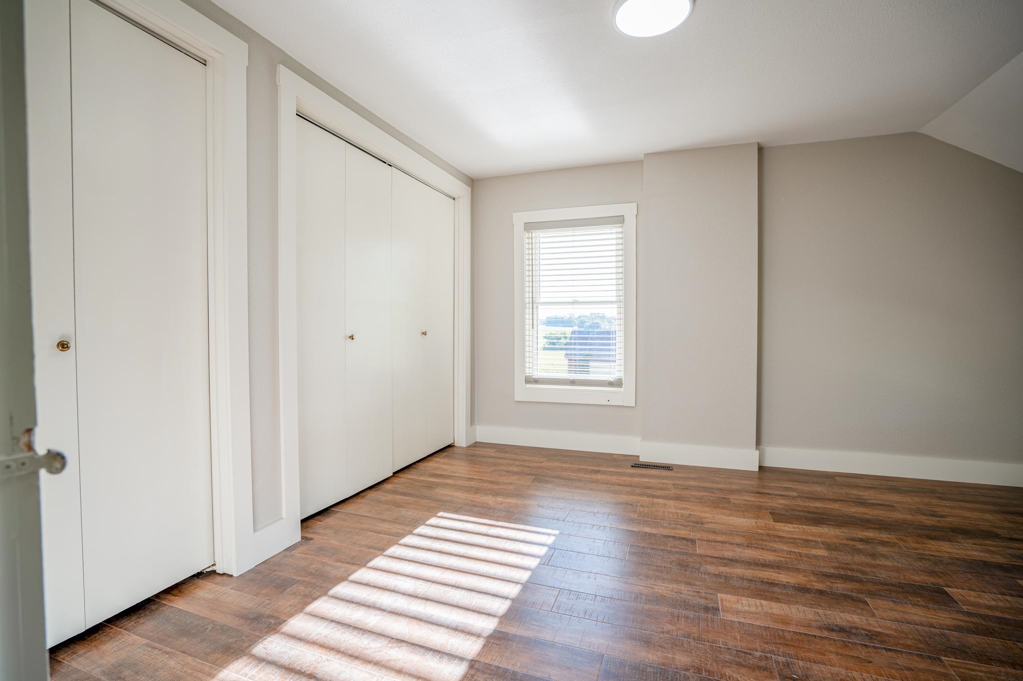 2368 West Winneshiek Road Freeport, IL 61032 - Photo 20 of 39 a view of wooden floor and windows in a room