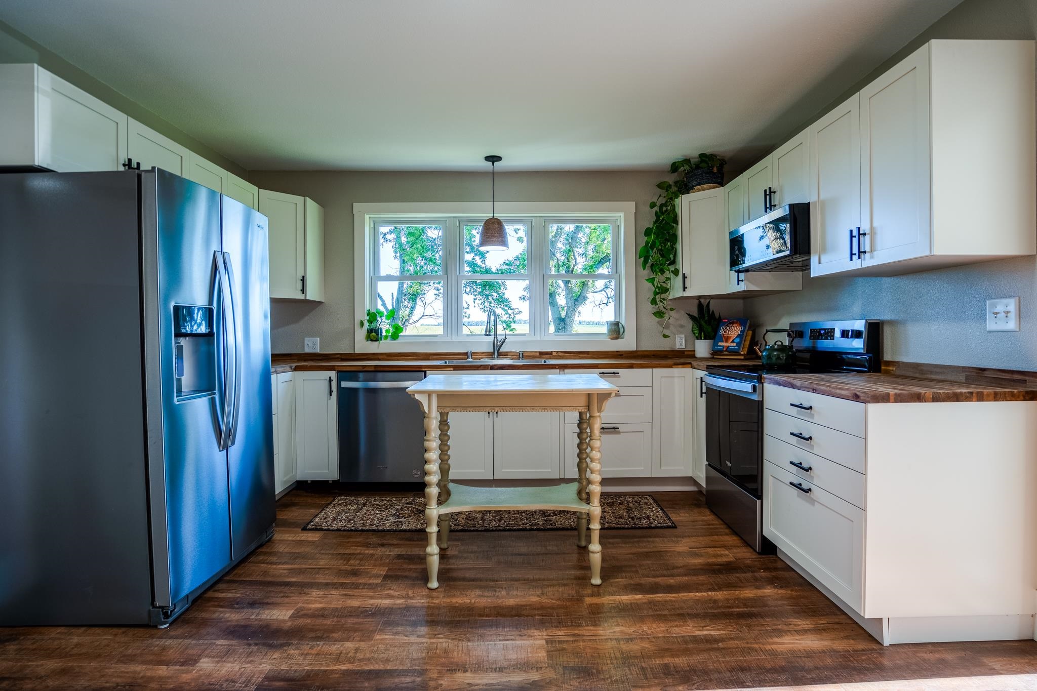 2368 West Winneshiek Road Freeport, IL 61032 - Photo 2 of 39 a kitchen with white cabinets and wooden floor