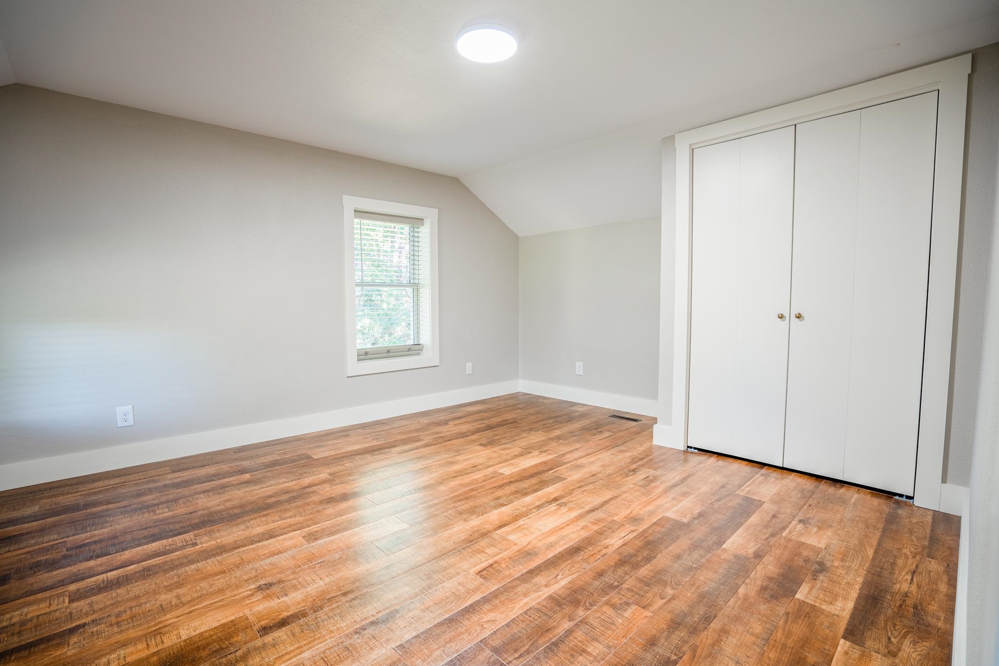 2368 West Winneshiek Road Freeport, IL 61032 - Photo 24 of 39 a view of empty room with wooden floor and fan