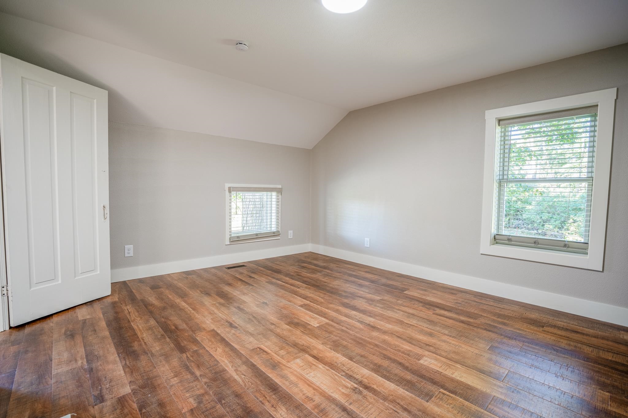 2368 West Winneshiek Road Freeport, IL 61032 - Photo 25 of 39 a view of an empty room with wooden floor and a window