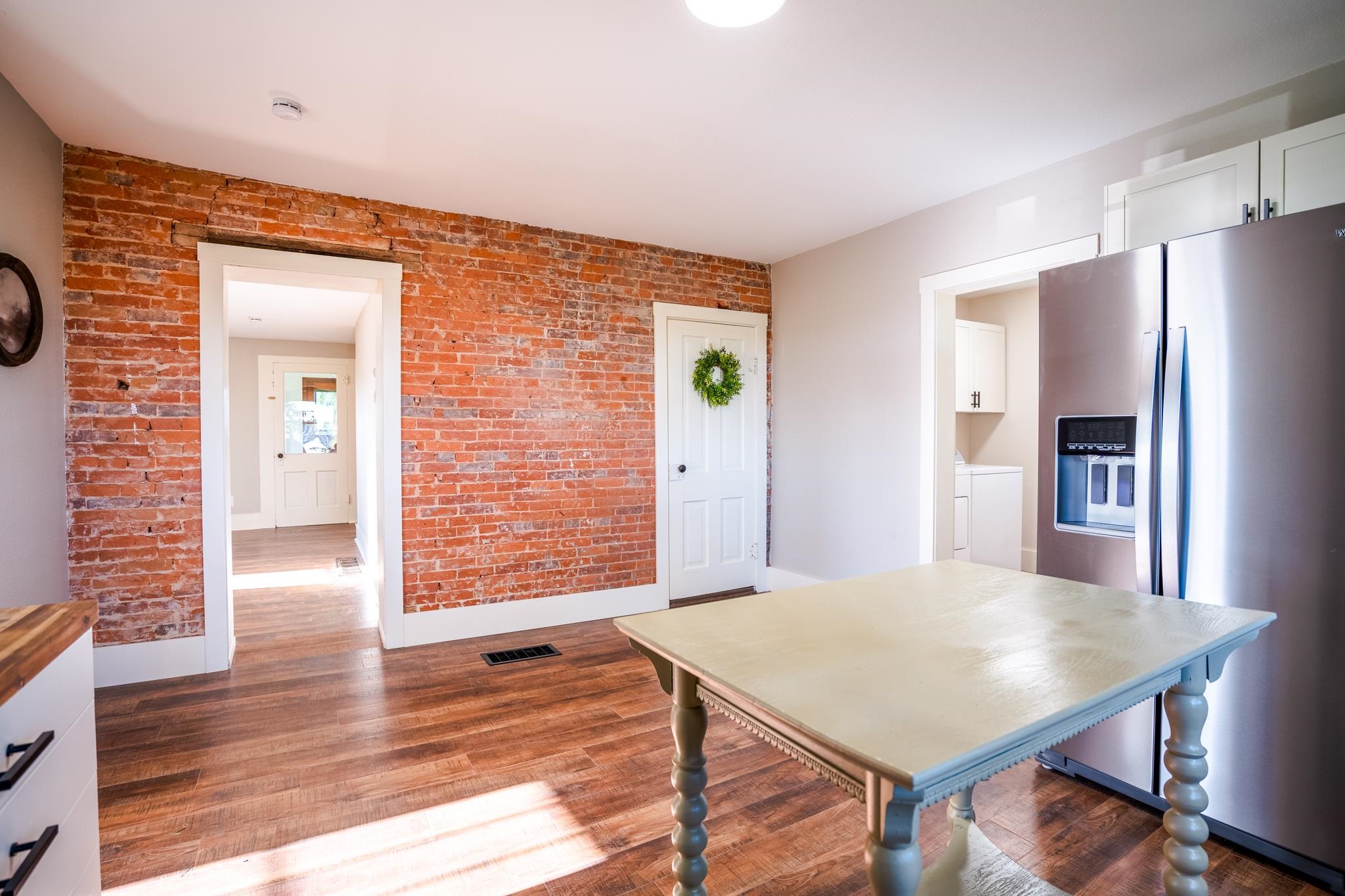 2368 West Winneshiek Road Freeport, IL 61032 - Photo 6 of 39 a view of a kitchen with furniture and wooden floor