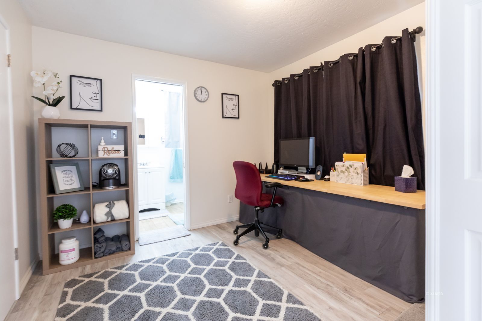 317 South Silver Ridge Street Ridgecrest, CA 93555 - Photo 15 of 28 a room with furniture a rug and a painting on the wall