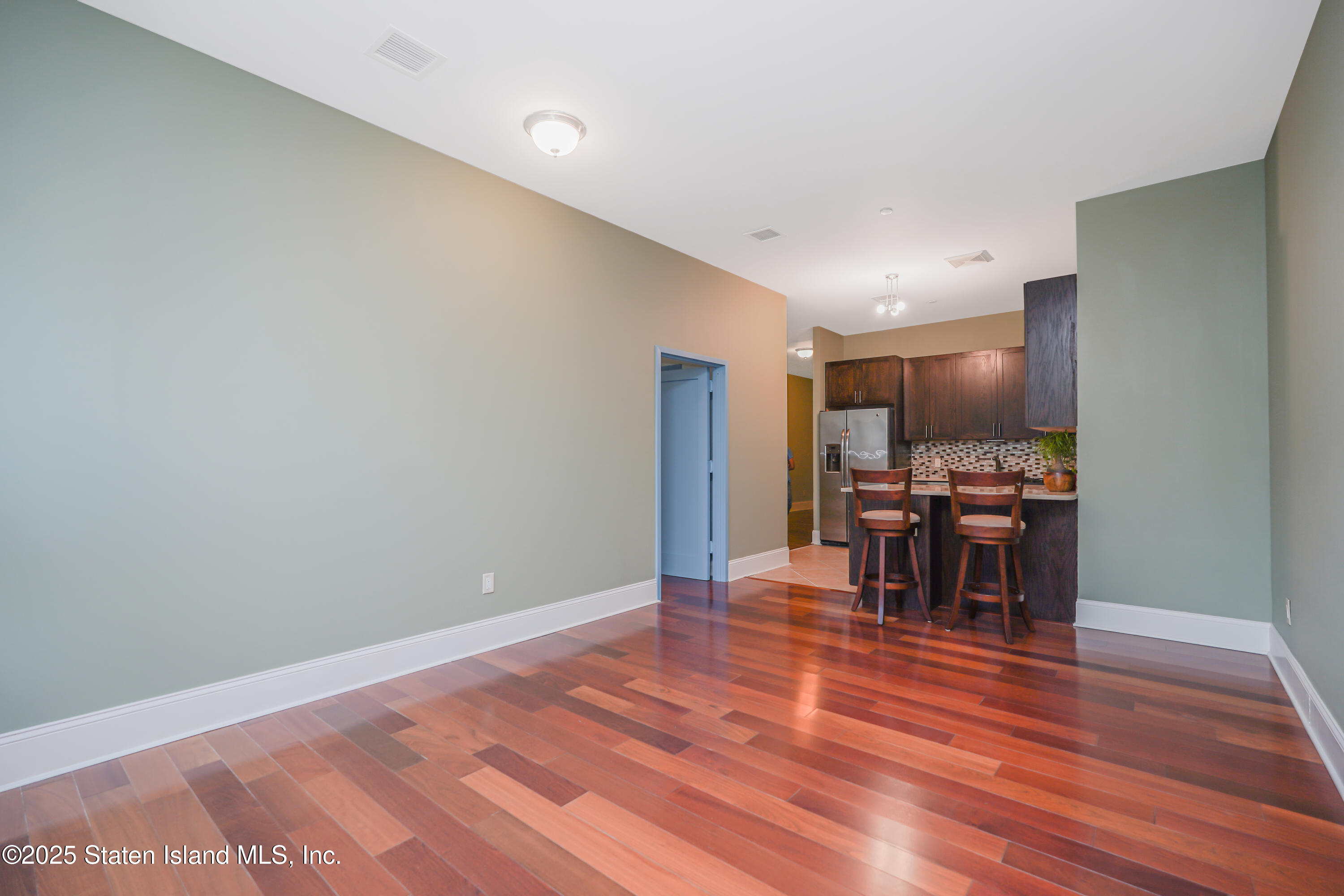 90 Bay Street Landing, Unit 1E Staten Island, NY 10301 - Photo 12 of 43 a view of dining room with furniture and wooden floor