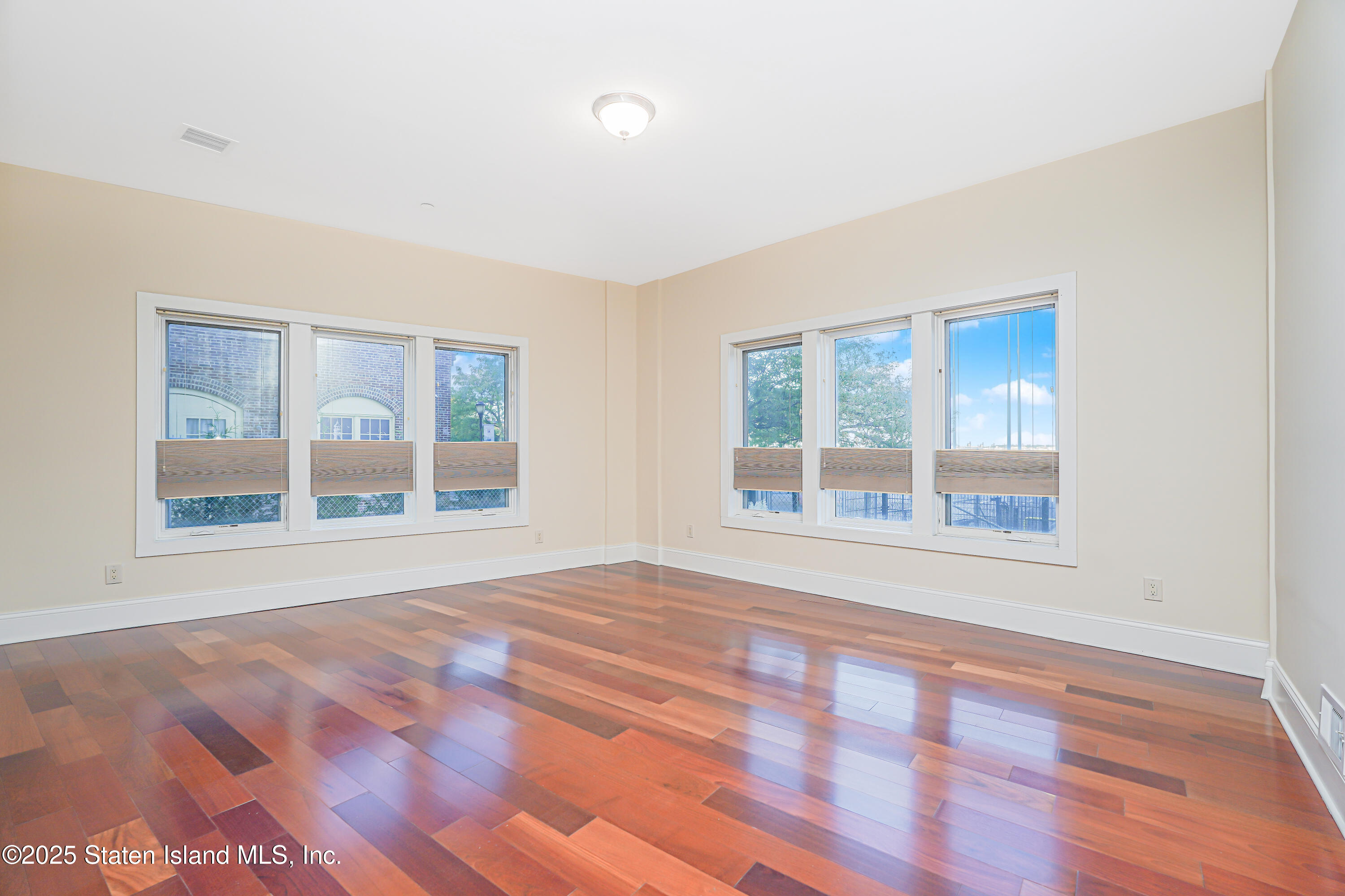 90 Bay Street Landing, Unit 1E Staten Island, NY 10301 - Photo 16 of 43 a view of an empty room with a window