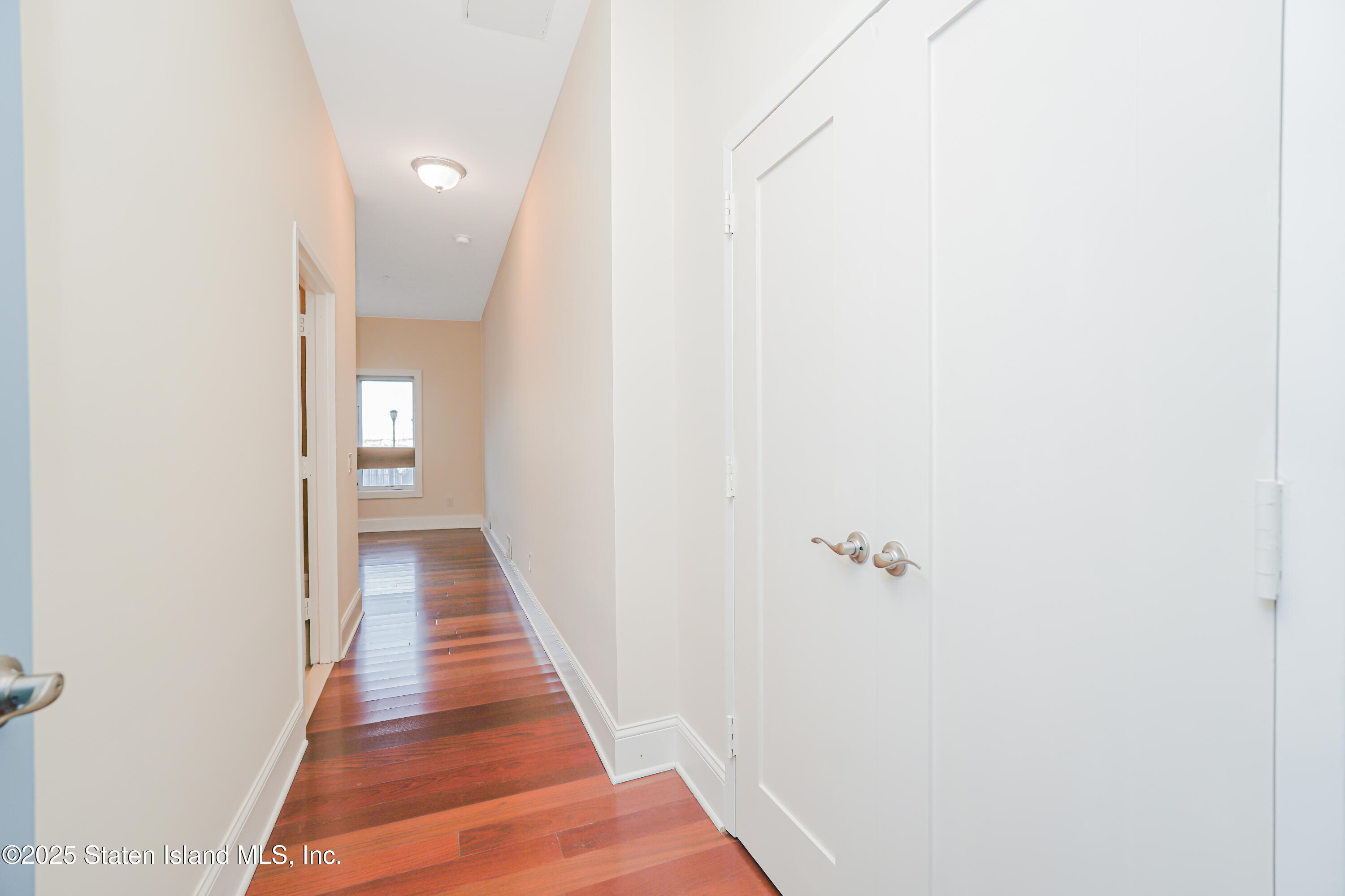 90 Bay Street Landing, Unit 1E Staten Island, NY 10301 - Photo 22 of 43 a view of a room with door