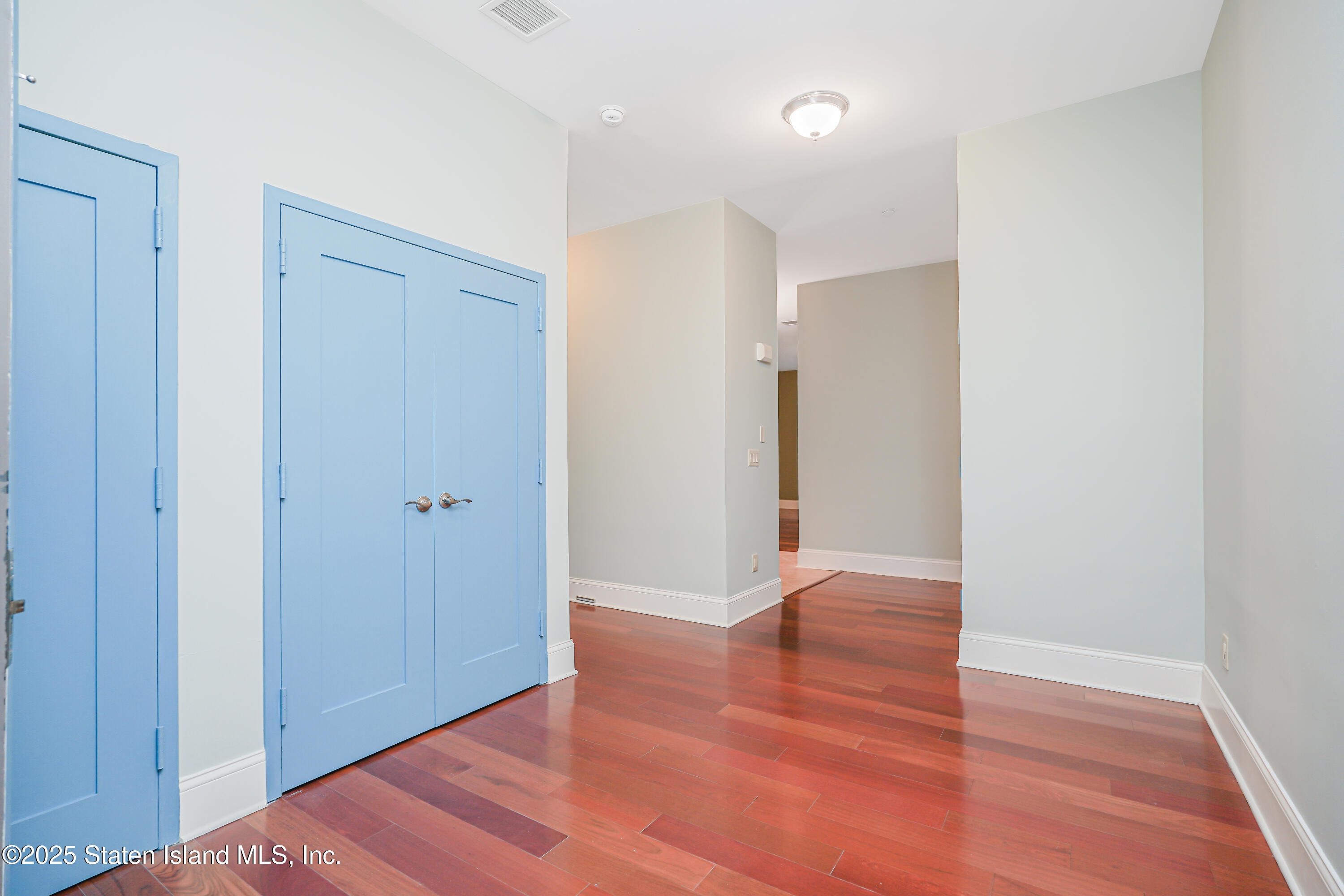90 Bay Street Landing, Unit 1E Staten Island, NY 10301 - Photo 29 of 43 a view of hallway with wooden floor