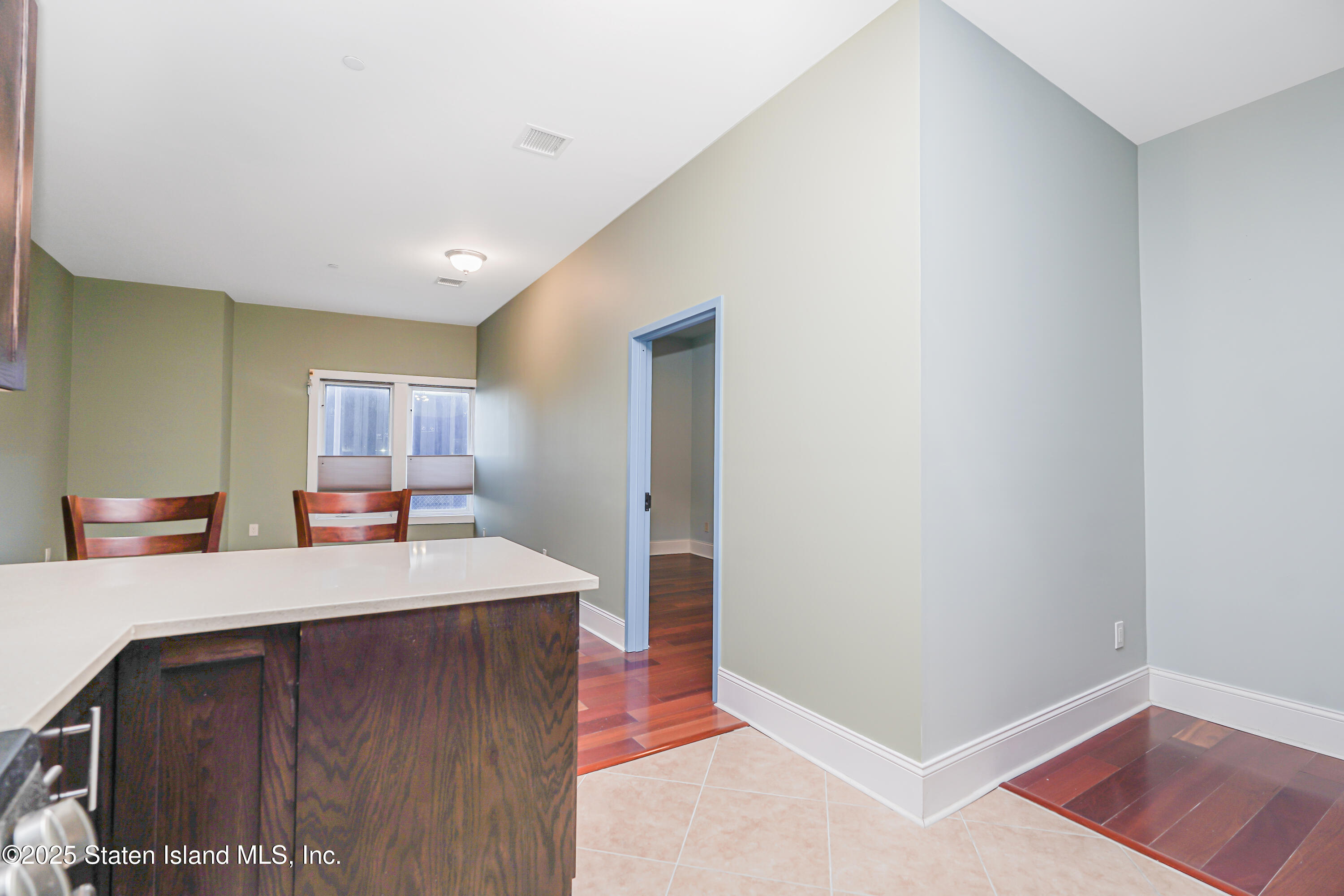 90 Bay Street Landing, Unit 1E Staten Island, NY 10301 - Photo 9 of 43 a room with a sink and a dresser