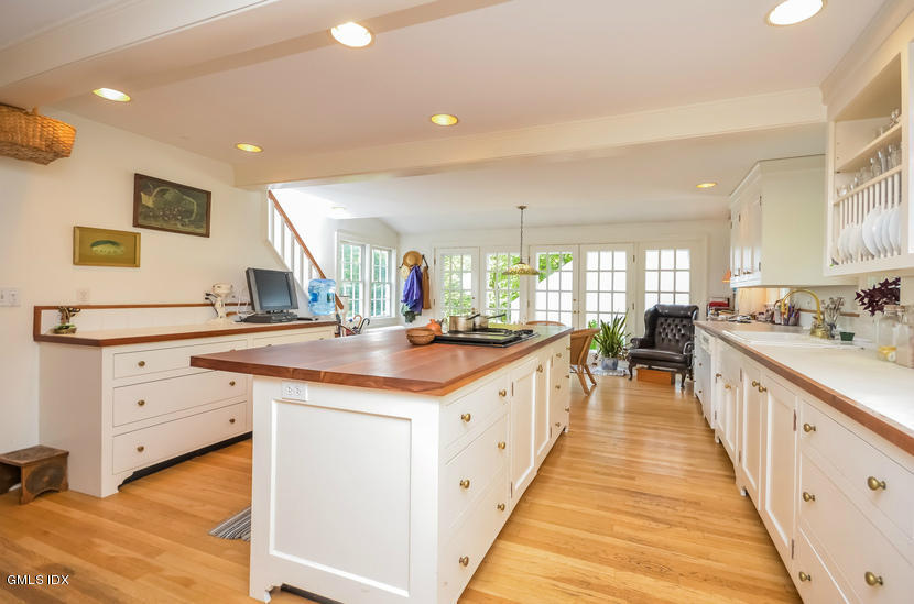 127 Dingletown Road Greenwich, CT 06830 - Photo 12 of 48 a kitchen with granite countertop a sink and cabinets