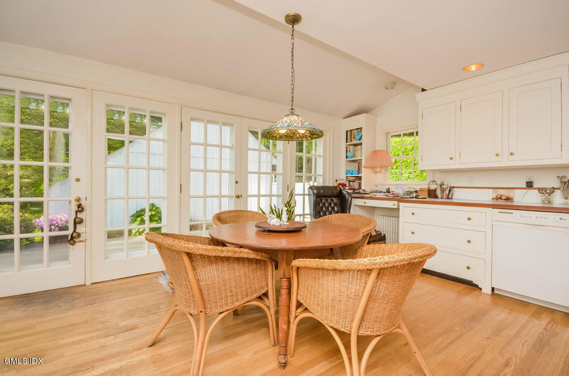 127 Dingletown Road Greenwich, CT 06830 - Photo 14 of 48 a view of a dining room with furniture a chandelier and wooden floor