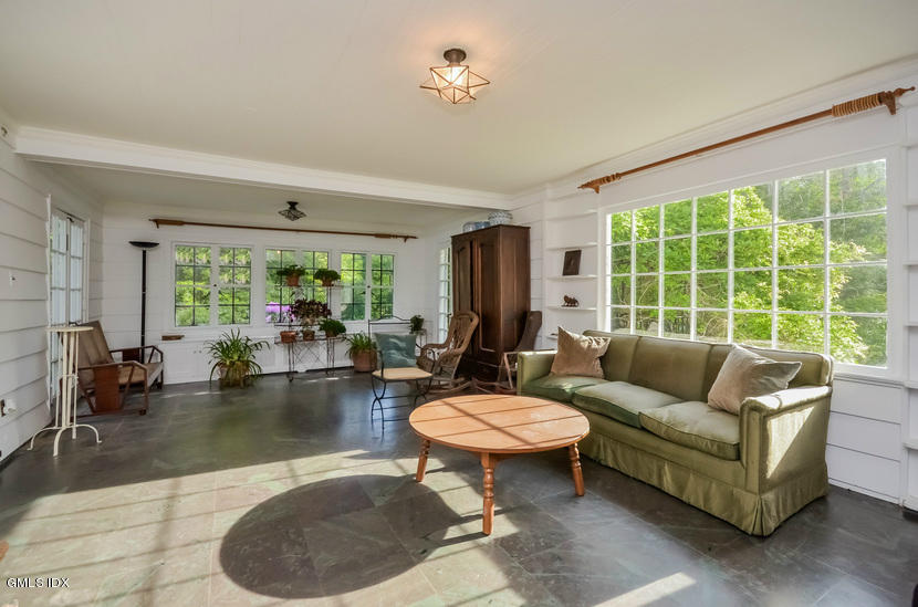 127 Dingletown Road Greenwich, CT 06830 - Photo 16 of 48 a living room with furniture and a large window