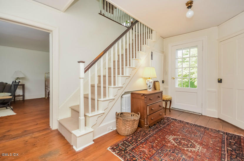 127 Dingletown Road Greenwich, CT 06830 - Photo 18 of 48 a living room with furniture and a wooden floor