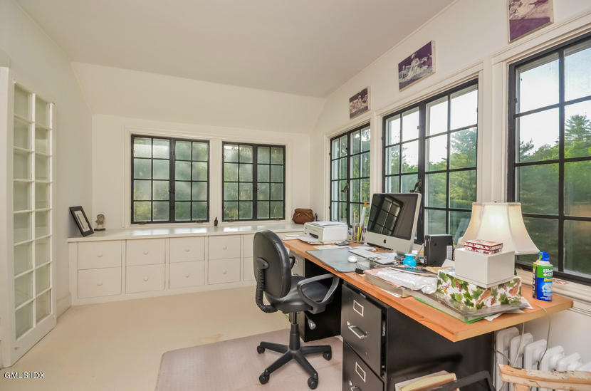 127 Dingletown Road Greenwich, CT 06830 - Photo 22 of 48 a view of a workspace with furniture and a window