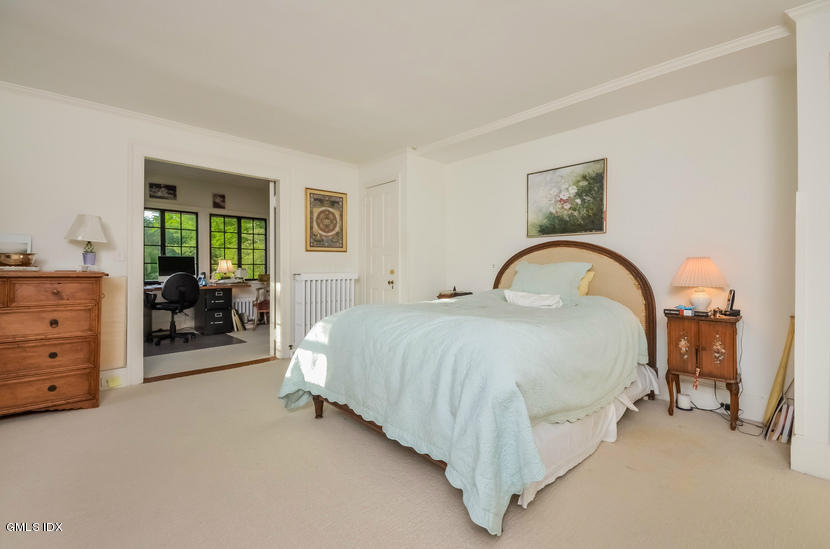 127 Dingletown Road Greenwich, CT 06830 - Photo 24 of 48 a spacious bedroom with a bed and a dresser