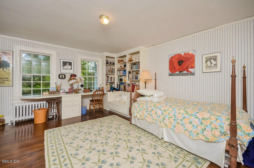 127 Dingletown Road Greenwich, CT 06830 - Photo 28 of 48 a bedroom with furniture and a large window