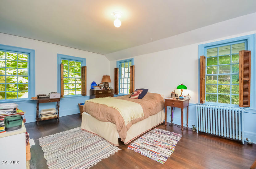 127 Dingletown Road Greenwich, CT 06830 - Photo 29 of 48 a bedroom with two beds and a large window