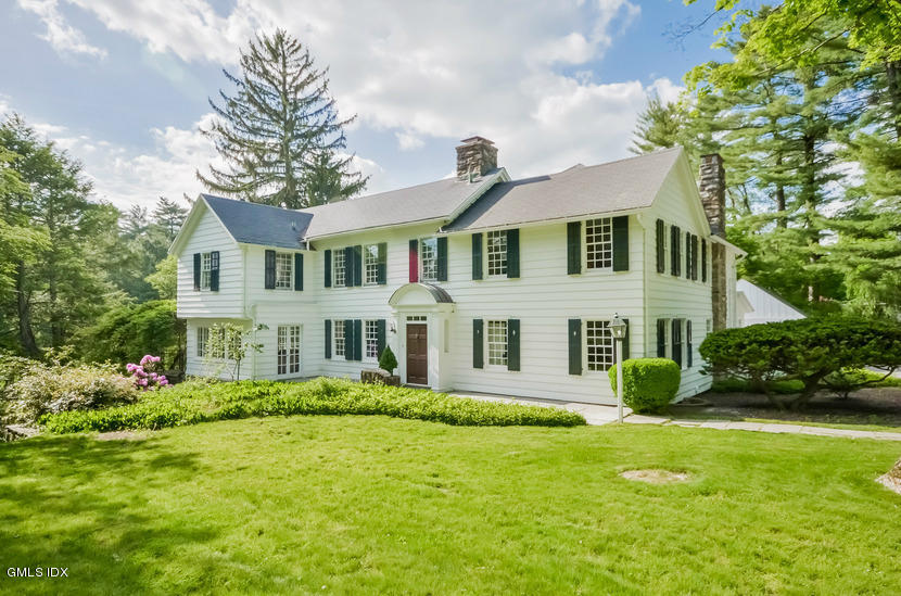 127 Dingletown Road Greenwich, CT 06830 - Photo 3 of 48 a front view of a house with garden and trees