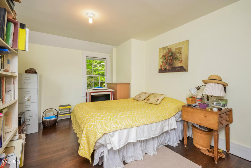 127 Dingletown Road Greenwich, CT 06830 - Photo 31 of 48 a bedroom with a bed and a flat screen tv