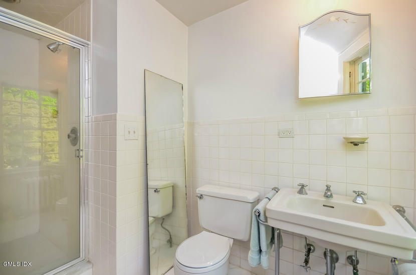 127 Dingletown Road Greenwich, CT 06830 - Photo 32 of 48 a bathroom with a sink a toilet and shower