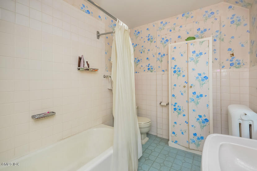 127 Dingletown Road Greenwich, CT 06830 - Photo 33 of 48 a bathroom with a bathtub and shower