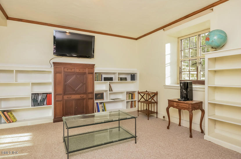 127 Dingletown Road Greenwich, CT 06830 - Photo 35 of 48 a living room with furniture and a flat screen tv