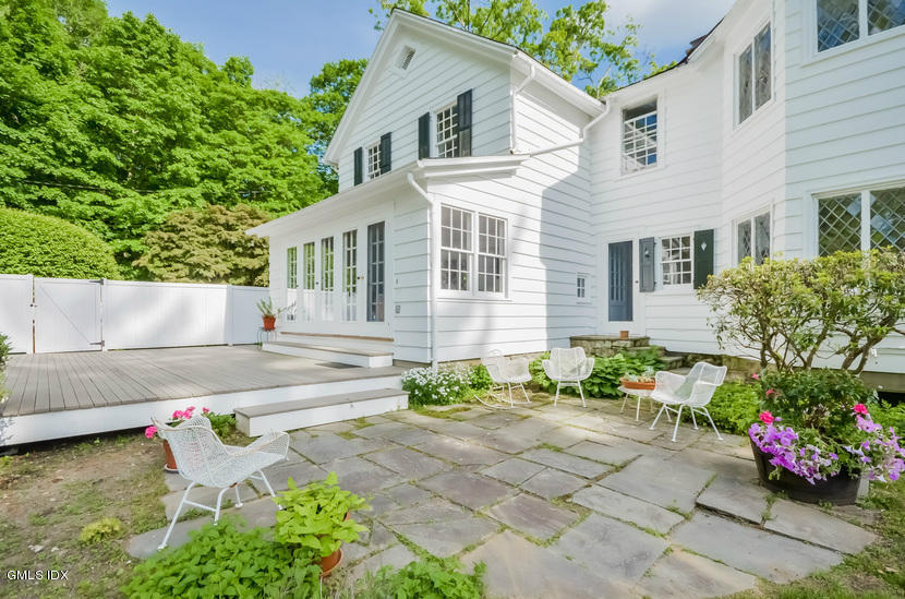 127 Dingletown Road Greenwich, CT 06830 - Photo 36 of 48 a view of a backyard with chairs potted plants