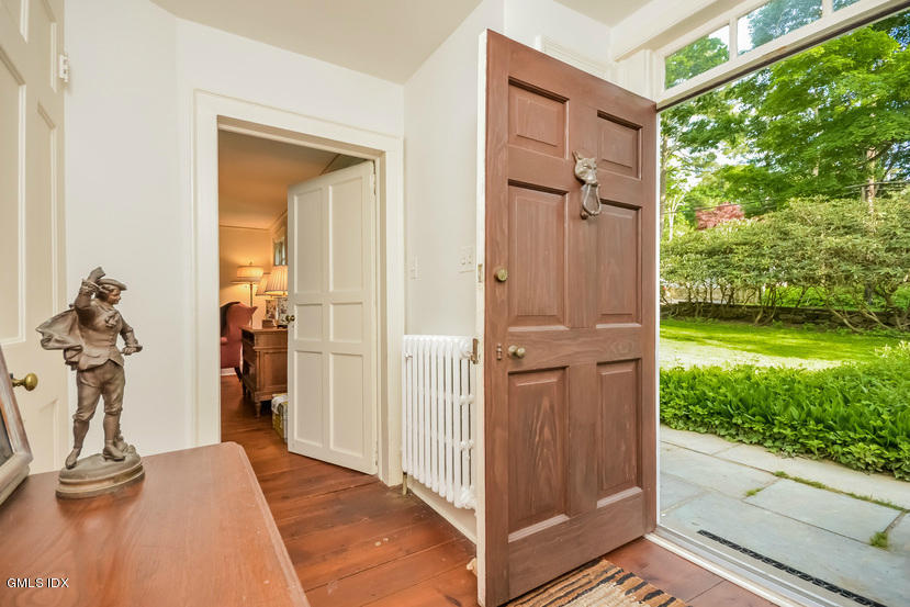 127 Dingletown Road Greenwich, CT 06830 - Photo 5 of 48 a view of a livingroom with a large window and garden