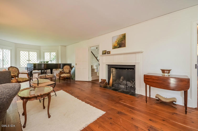 127 Dingletown Road Greenwich, CT 06830 - Photo 6 of 48 a living room with furniture and a fireplace