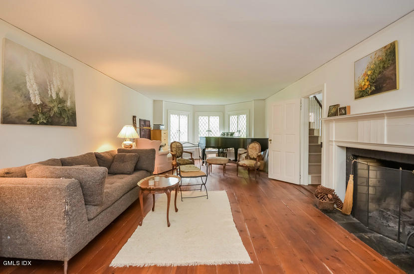 127 Dingletown Road Greenwich, CT 06830 - Photo 8 of 48 a living room with furniture and a fireplace