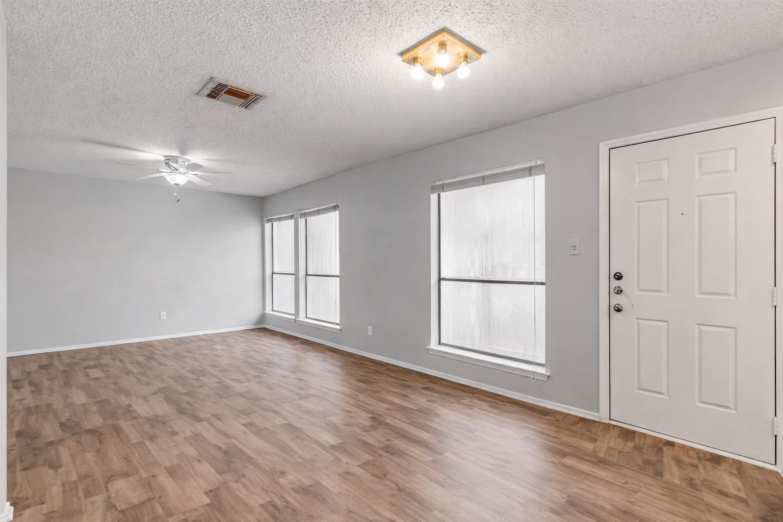 3115 Helms Street, Unit 210 Austin, TX 78705 - Photo 9 of 17 an empty room with windows and closet