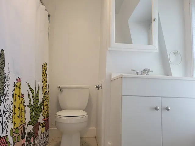 a bathroom with a toilet and a sink