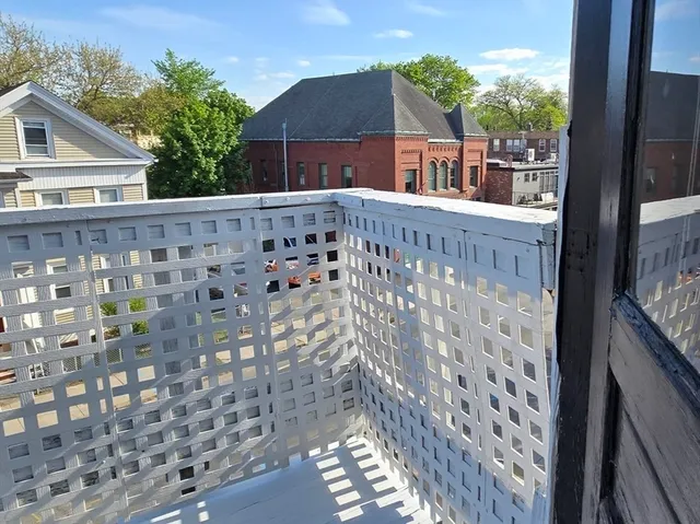 a view of a brick house with a street