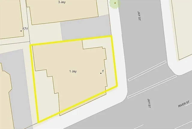 a sign on the wall with a open kitchen