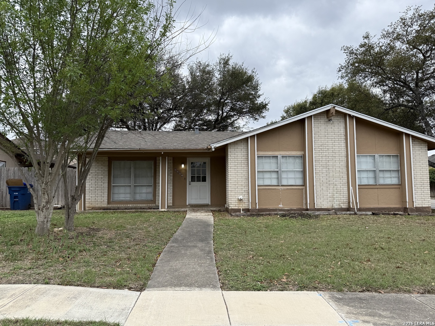 6626 Spring Garden Street San Antonio, TX 78249 - Photo 1 of 10 a front view of a house with garden