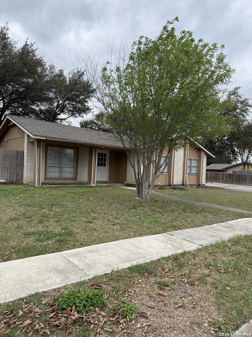 6626 Spring Garden Street San Antonio, TX 78249 - Photo 2 of 10 a front view of a house with a yard