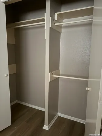 a view of an empty walk in closet