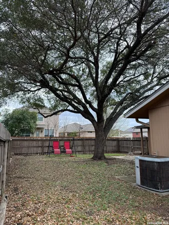 a view of backyard with green space
