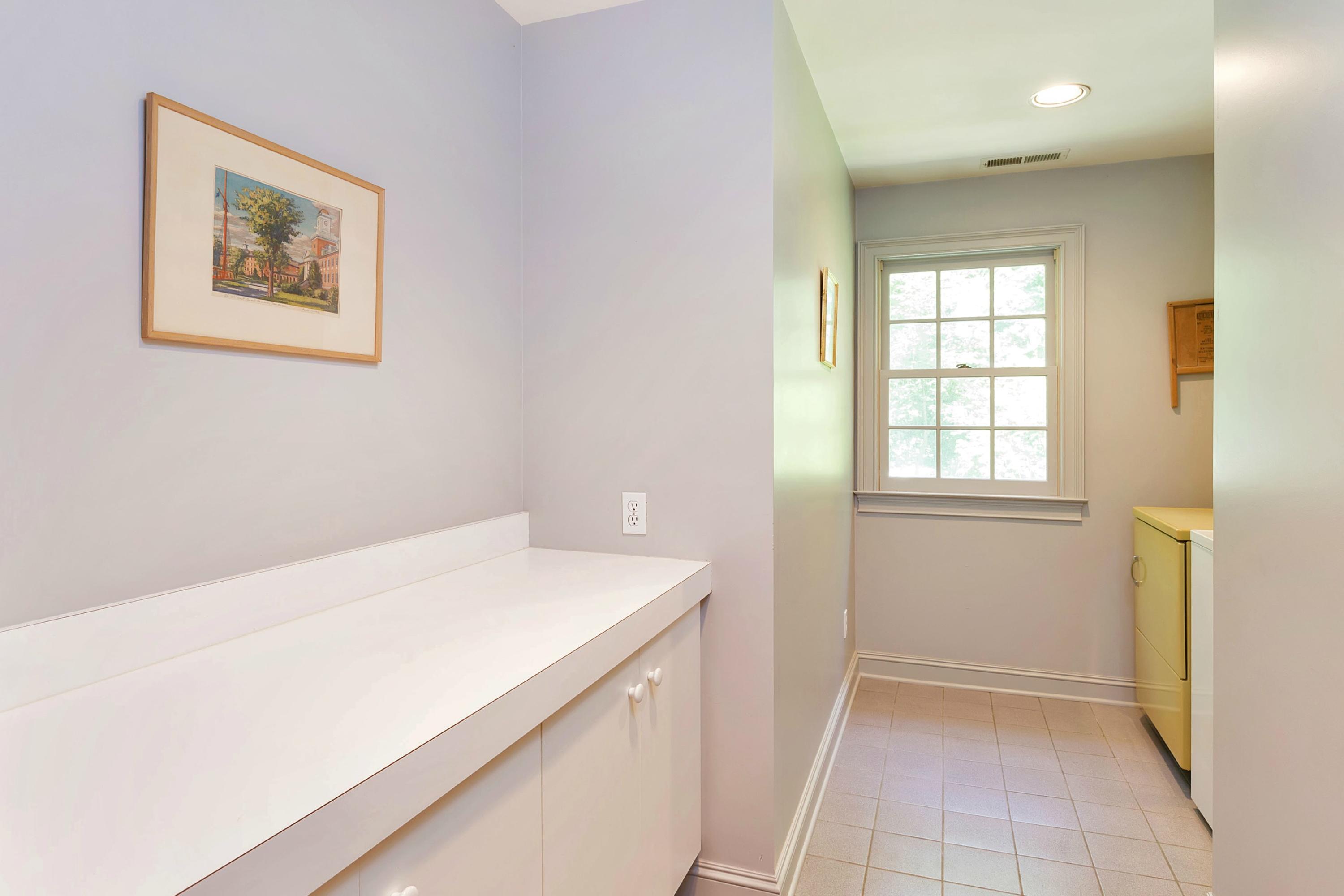 55 Rings End Road Darien, CT 06820 - Photo 17 of 29 a utility room with a window