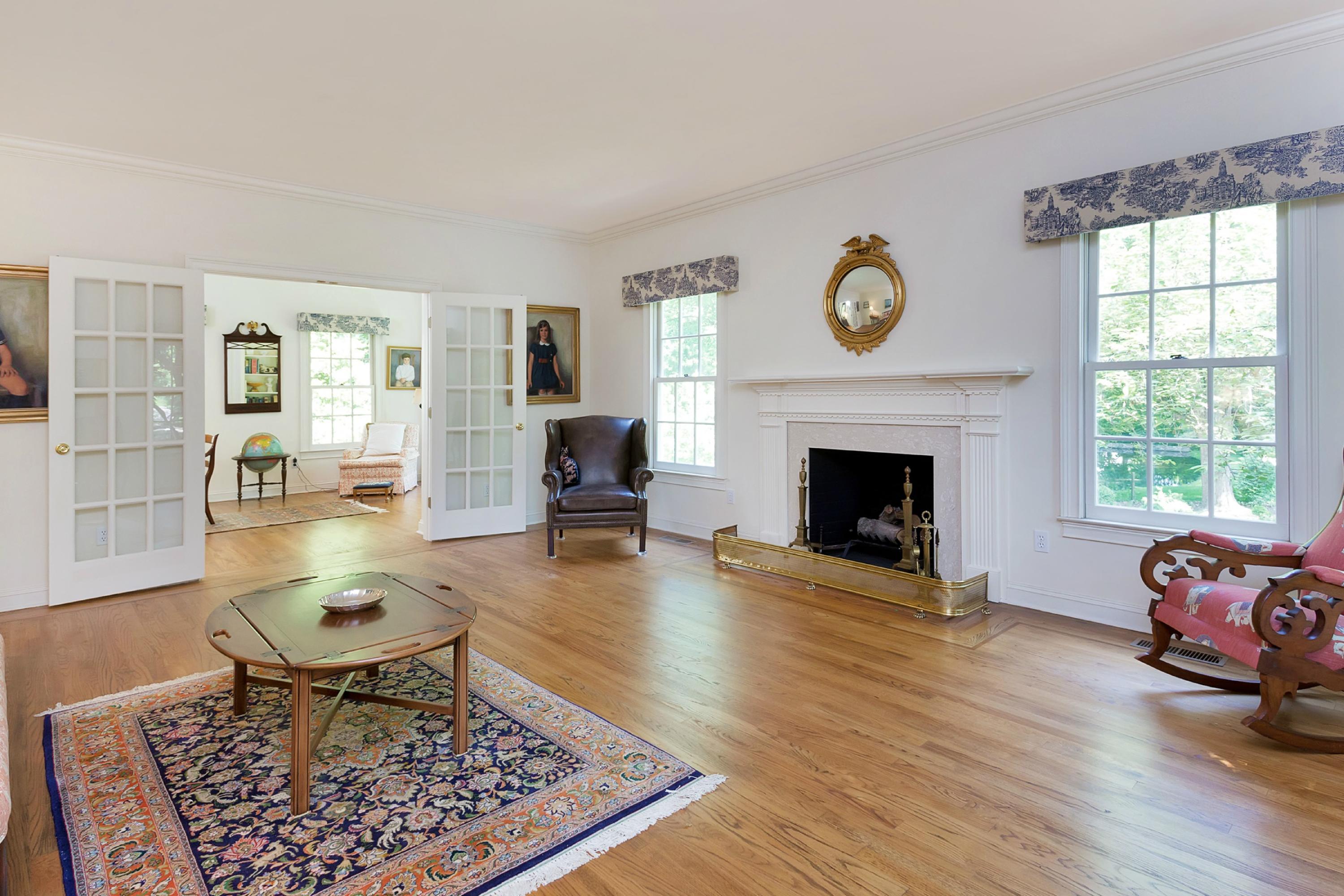 55 Rings End Road Darien, CT 06820 - Photo 5 of 29 a living room with furniture and a fireplace