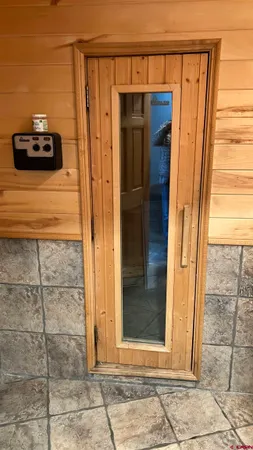 a view of a door and an empty room