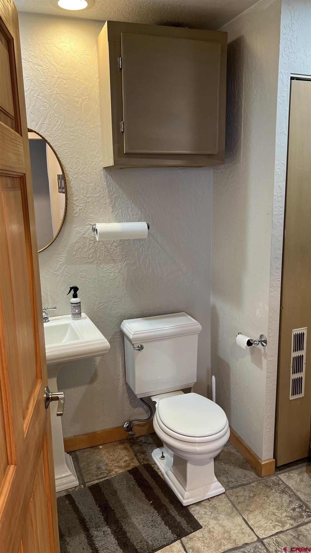 3065 Main Avenue Durango, CO 81301 - Photo 12 of 14 a bathroom with a toilet a sink and mirror