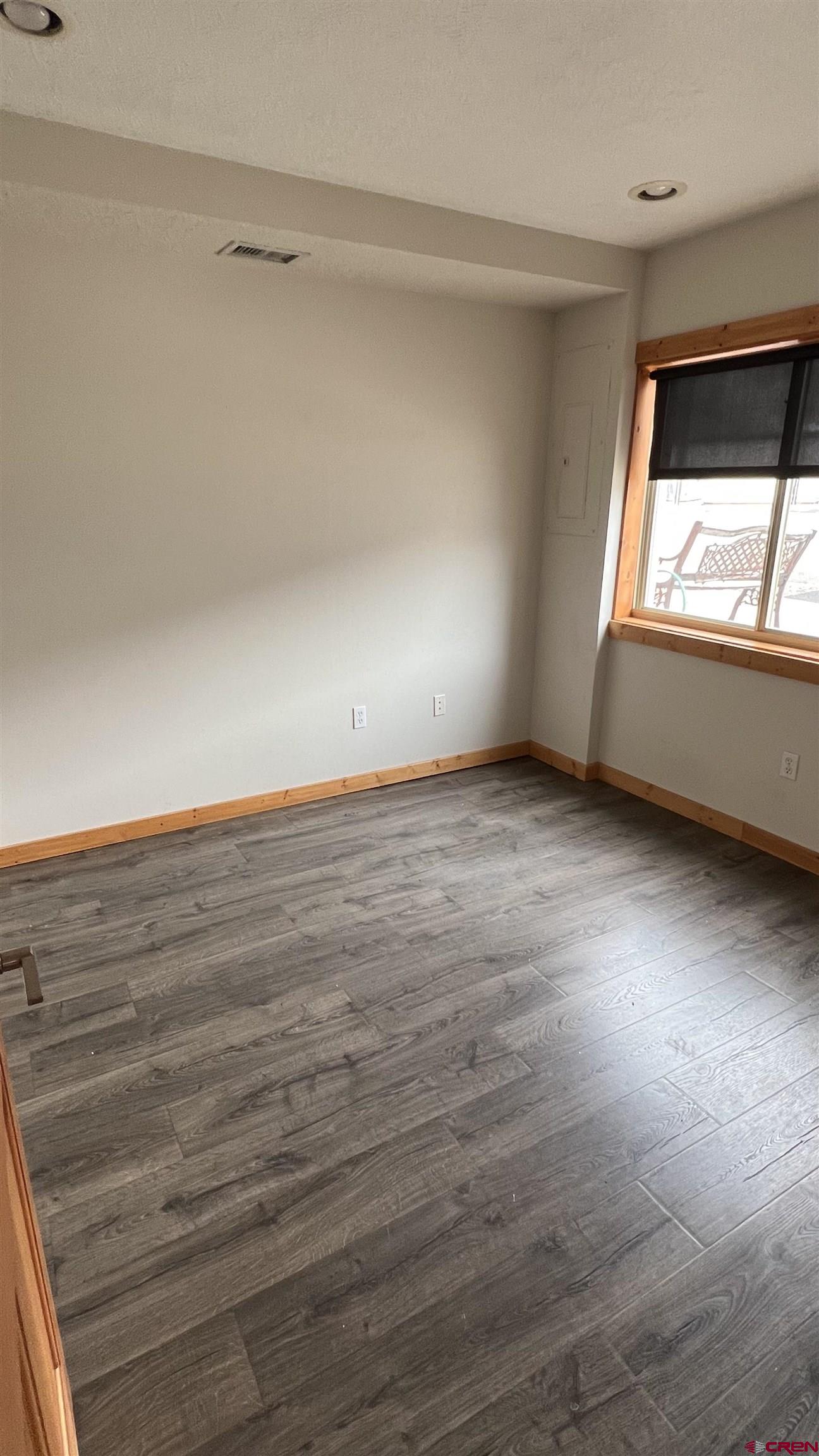 3065 Main Avenue Durango, CO 81301 - Photo 13 of 14 a view of an empty room with wooden floor and a window