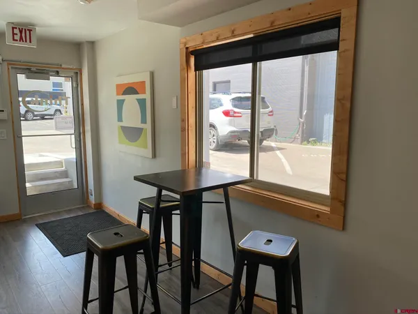 a view of a room with furniture and window