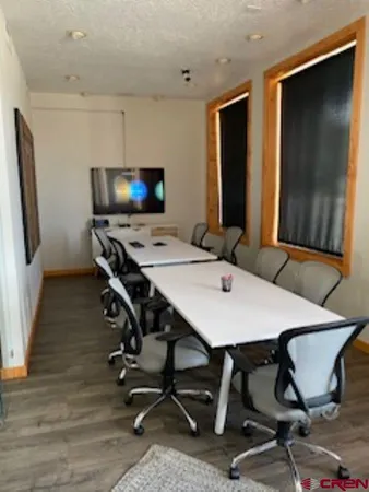 a view of a workspace with furniture